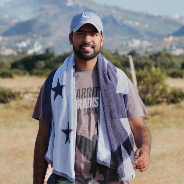 Kaveri Mehta, Lead Design Curator at NeatPaperWorks, reviewing corporate floral arrangements